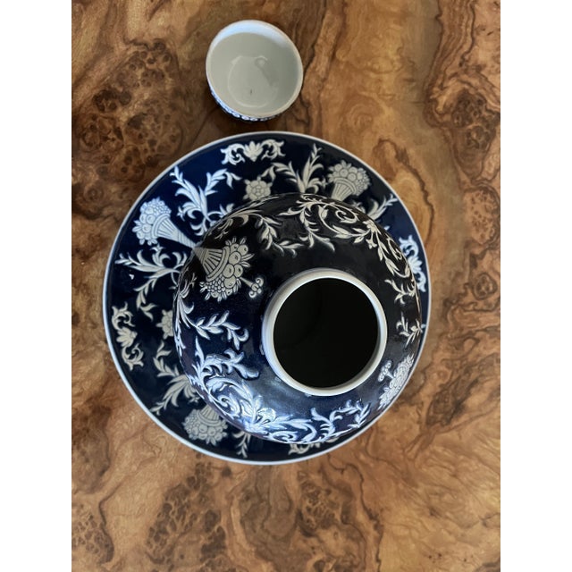 Dark blue and white ginger jar and plate set. Made in China. Beautiful color and textured design with floral, fruit,...