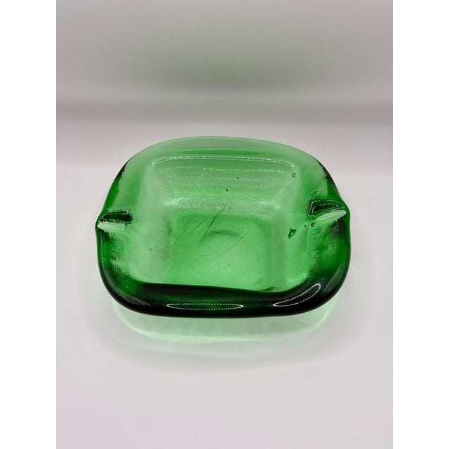 Please read the entire description. A striking vintage green art glass ashtray with a sculptural, heavy glass form and...