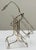 Lovely vintage silver-plated wine bottle holder featuring and adjustable neck ring to accommodate different bottle shapes....