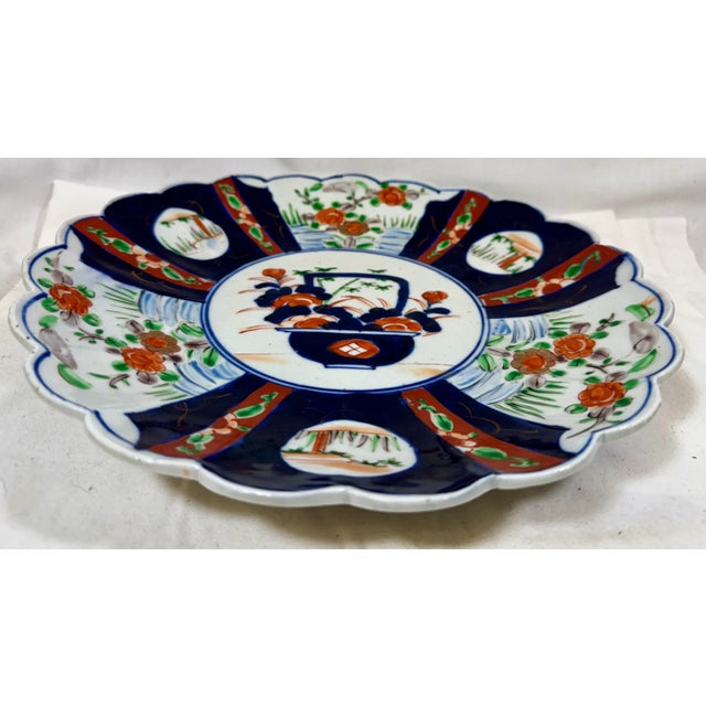 Blue Large Antique Scalloped Edge Porcelain Imari Plate Decorated With Rich Colored Floral & Landscape Scenes From Japan - Circa 1880 For Sale - Image 8 of 11