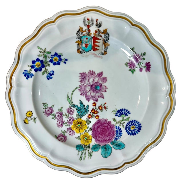 A fine pair of Chinese export porcelain plates dating to circa 1780 to 1790. Each plate is hand painted in the Famille...