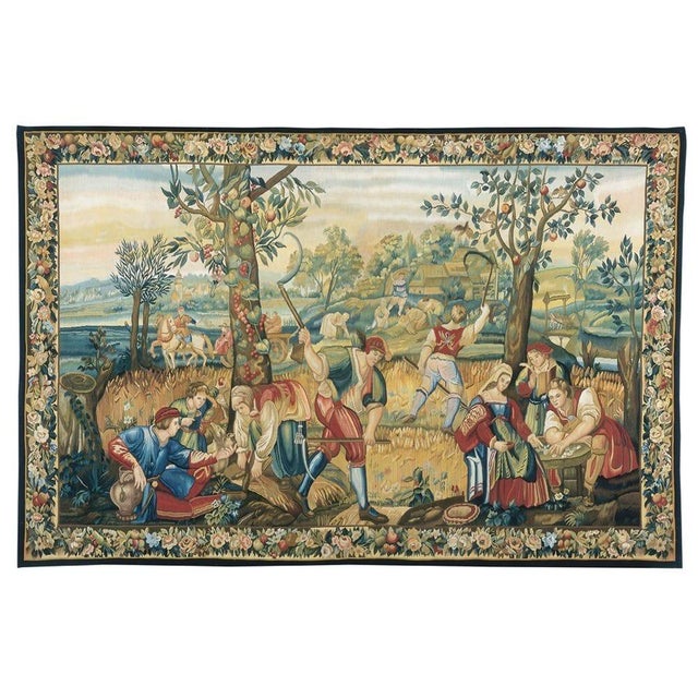 A 17th Century tapestry depicting the summer season, with harvesters reaping in the fields and receiving wages for their...