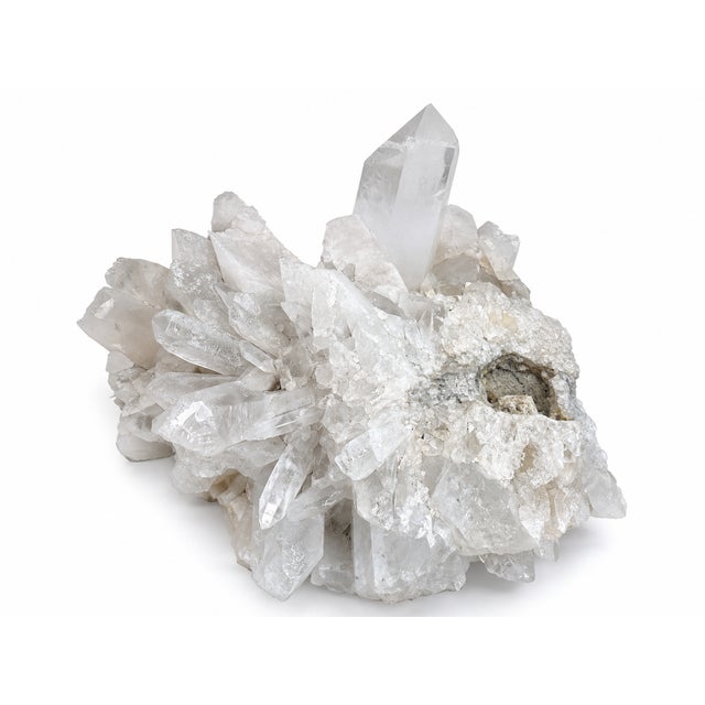 Monumental natural Brazilian quartz crystal cluster measuring approximately 34 inches long by 26 inches wide by 15 inches...