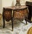 Make a statement with this magnificent French bombe commode, showcasing exceptional floral marquetry, graceful serpentine...