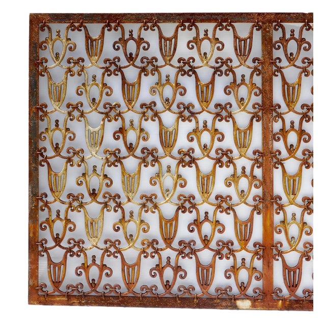 Outstanding Art Deco style hand wrought tripartite grille of impressive scale, having an intricate and delicate pattern of...