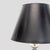 This stylish table lamp features a black lampshade and a unique base made of stacked clear glass spheres. Its sleek design...