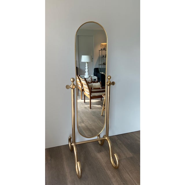 This beautiful swivel psyche mirror is made of brass. It is a French work. Circa 1970