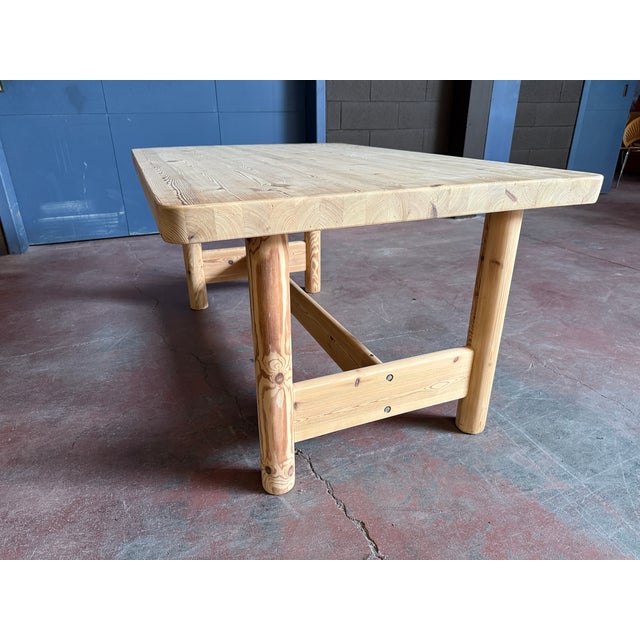 Impressive solid pine dining table with very thick top and rounded legs designed by Knud Friis & Elmar Moltke Nielsen for...