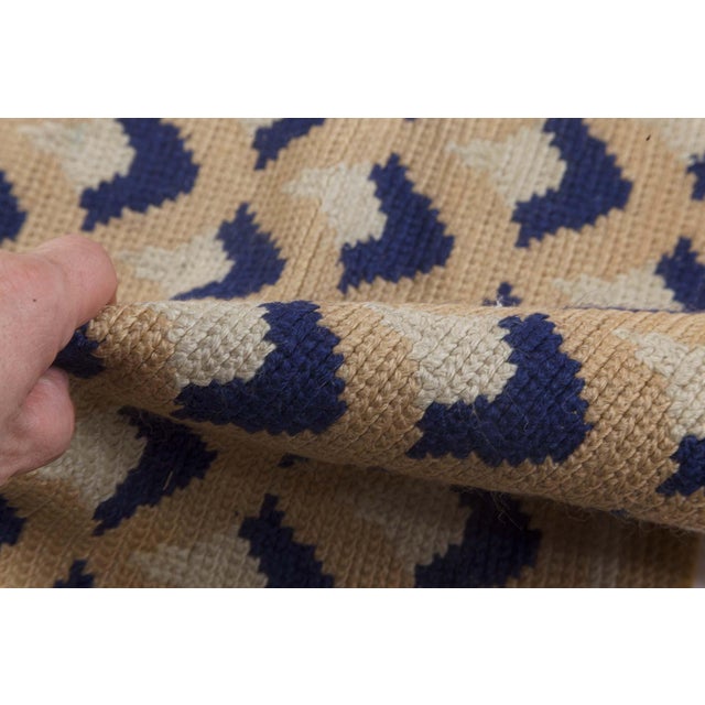 This stunning antique Portuguese needlepoint rug from the 1940s offers an exceptional combination of mid-century charm and...