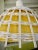 This chandelier is from 1960 in white wicker with a yellow textile insert, and a porcelain top, you will see a picture...