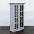This Crate & Barrel bookshelf features a clean, modern design with glass double doors and a soft gray finish. It includes...