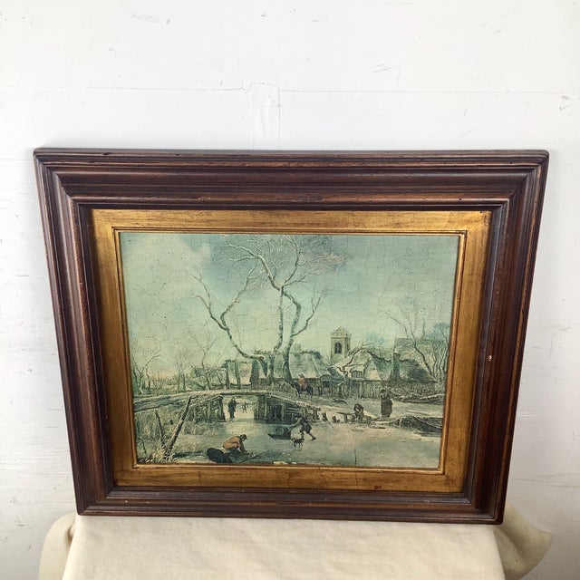 This antique European winter landscape captures a quiet village scene frozen in time, with figures crossing a wooden...