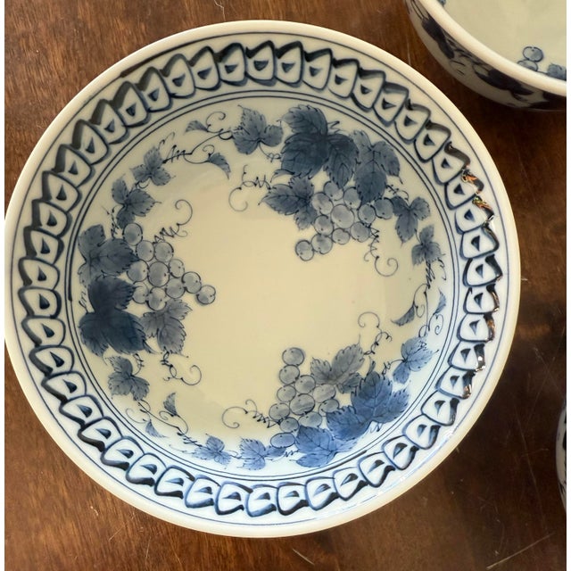 This set of three vintage Japanese porcelain bowls, approximately 6 inches in diameter by 2 3/4 inches tall featuring a...