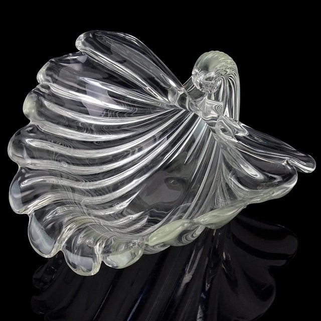 Beautiful vintage Murano hand blown crystal clear Italian art glass ribbed decorative seashell shape centerpiece bowl. The...