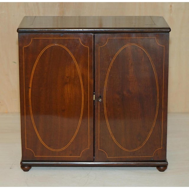 This stunning period perfect fully restored Antique Georgian Circa 1820 Sheraton collectors cabinet or table chest A very...