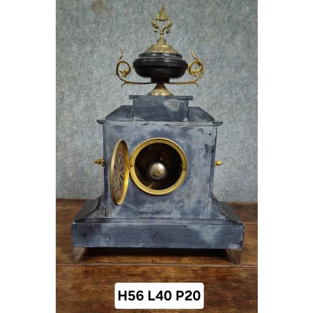 Large black marble and gilt bronze notary's clock, richly decorated in neoclassical style. enamelled dial, finely chiseled...