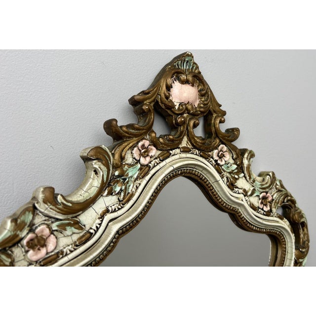 A stunning Vintage shabby chic wall mirror featuring an exceptionally ornate decorative frame with elegant scrolling...