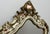 A stunning Vintage shabby chic wall mirror featuring an exceptionally ornate decorative frame with elegant scrolling...