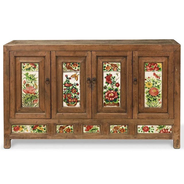This distinctive sideboard from Dongbei, circa 1880, features painted tiles inset into the frames of the doors and lower...