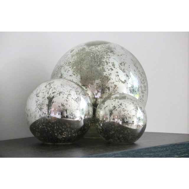 Add a touch of vintage charm to your home with this rare, complete set of 3 Pottery Barn mercury glass decorative globes...