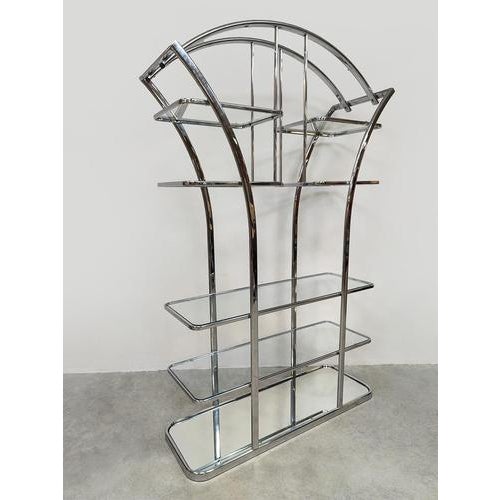 Mad men madness! Chrome is back in style. This vintage bookcase/room divider from the 1970s is made of chrome-plated steel...