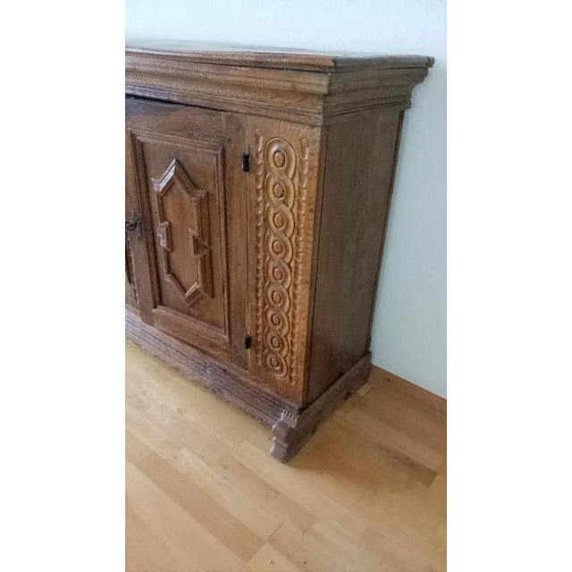Ancient baroque sideboard / credenza made of solid oak in good used condition. Dimensions: width 170 cm x height: 94 cm x...