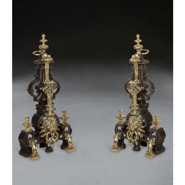 Pair of mid-19th Century decorative andirons or firedogs. Constructed of pierced cast-iron with good quality brass mounts...