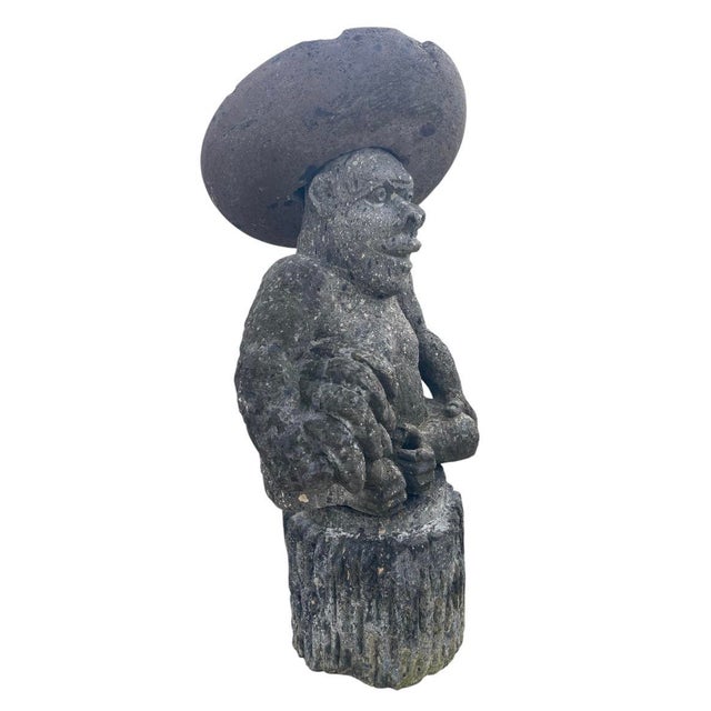 A wonderfully charming and expressive vintage garden sculpture hand-carved from dense, textured volcanic stone. This...