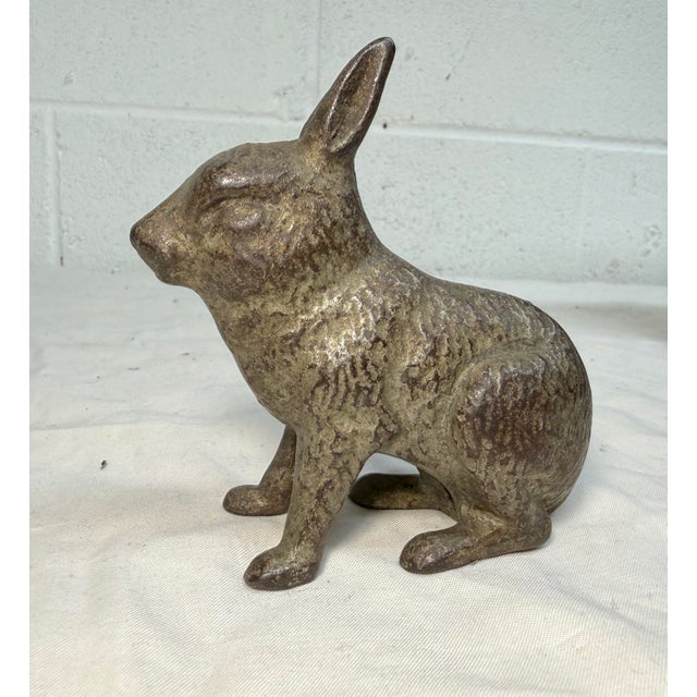 This rare antique 1920's Cast Iron bunny still bank by A.C. Williams is a unique and collectible piece with an exquisite...