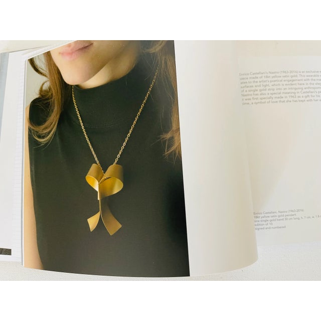Contemporary album on jewelry design with descriptions and illustrations.