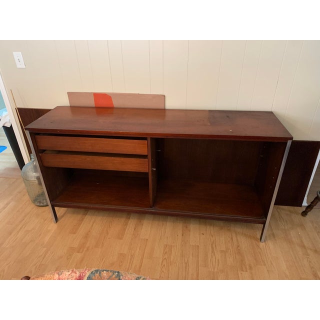 Mid-Century Modern Walnut Credenza designed by Paul McCobb for Calvin, circa 1950’s. Walnut grain with aluminum trim....