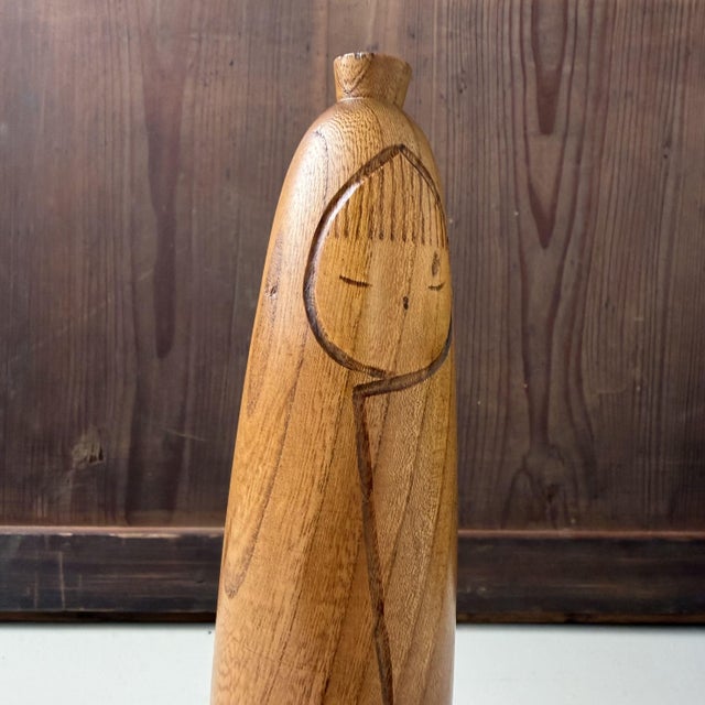 This vintage Japanese sōsaku kokeshi is an elegant and restrained work by Takanashi Hanpuushi, a maker known for his...