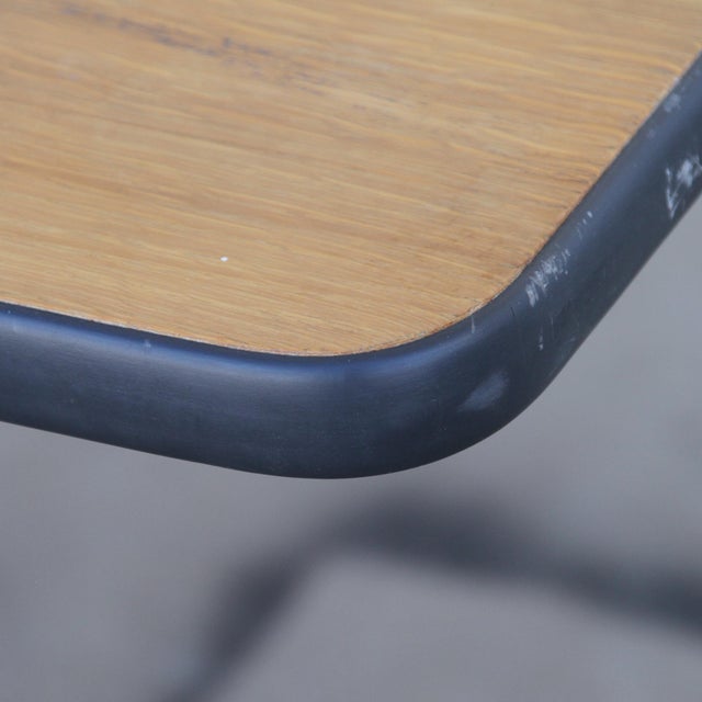 This is a Herman Miller Conference/Dining Table with a rectangular top. The top is made of walnut. The iconic base has...