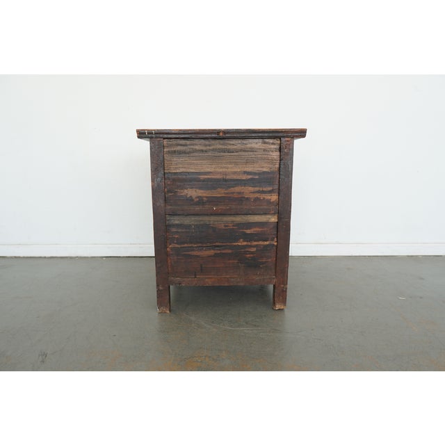 This vintage Asian apothecary chest features a beautifully timeworn wood surface and a striking grid of small drawers,...
