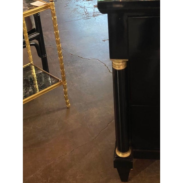 The 19th c. French Empire Black Lacquered Commode is a stylish and elegant dresser. This classic design and black...