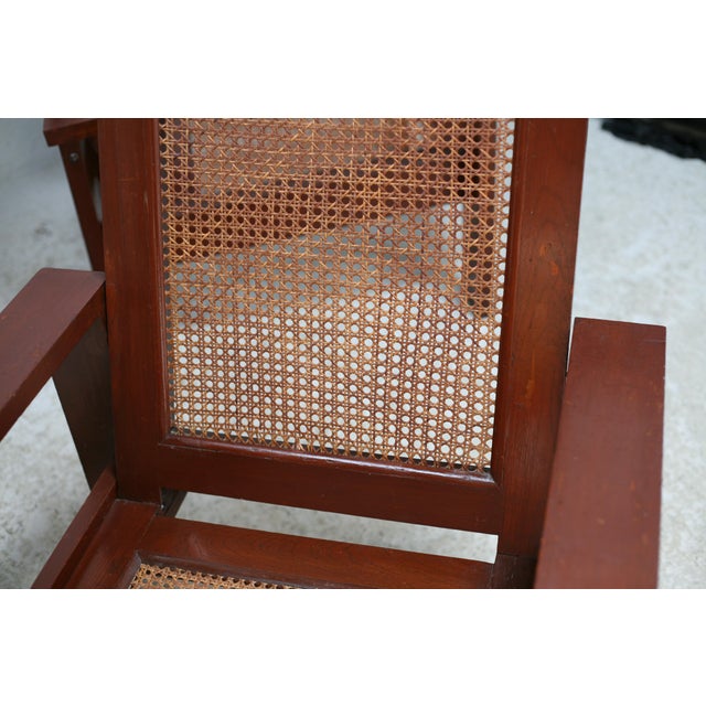 Pair of large armchairs. Wood and cane. Circa 1960 3 small cane jumps. Wood appearing to be originally painted brown...