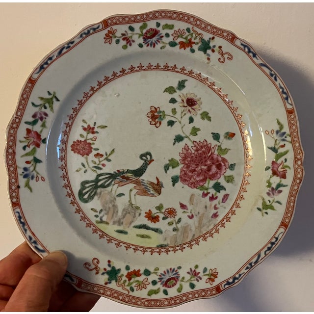 Pair antique 18th century Chinese export porcelain plates. Decorated with the twin peacock and peony pattern in a bright...