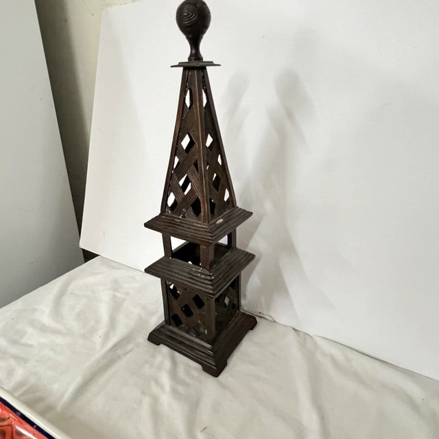 Bronze / brass tabletop obelisk with open work crisscross pattern. . Great for bookcase decor, tablescapes, etc. This one...