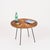 Charming and highly decorative Mid-Century round coffee table in hand-woven rattan wicker and black enameled iron. This...