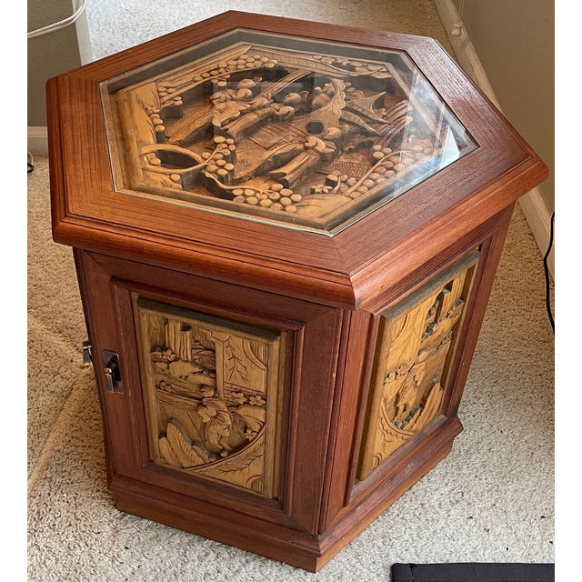 Hand-carved wooden hexagonal end table cabinet, priced individually (four total). Each cabinet has intricate Asian relief...