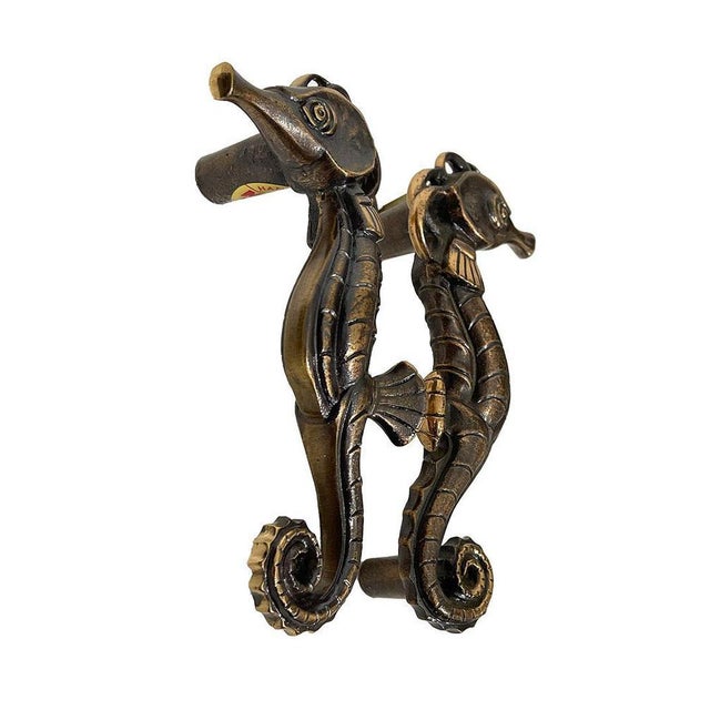Solid bronze door handles by MEKO, Germany 1970s. Two mirrored door handles with a scene of a Seahorse. Labeled with the...