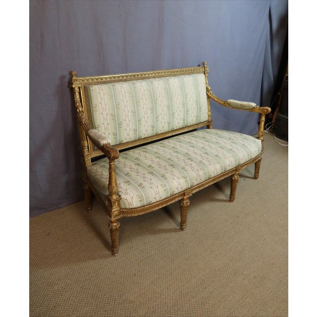 A napoleon iii period giltwood living room set comprising a sofa and four armchairs. this louis xvi style living room set...