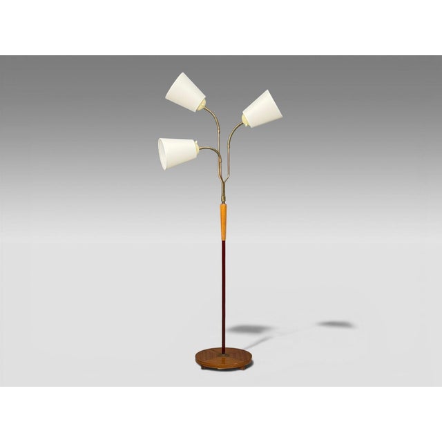 Swedish Mid-Century Modern, Adjustable Floor Lamp, Wood, Brass, Red Lacquer, Sweden, 1940s An interesting brass, wood, and...