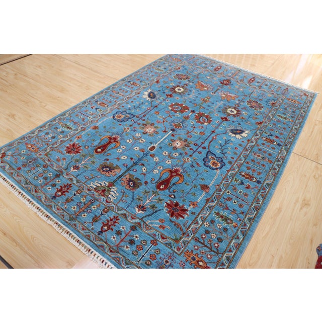 Beautiful hand-knotted Ziegler Sultanabad rug in soft sky blue with floral motifs in red, ivory, and gold tones. Made from...