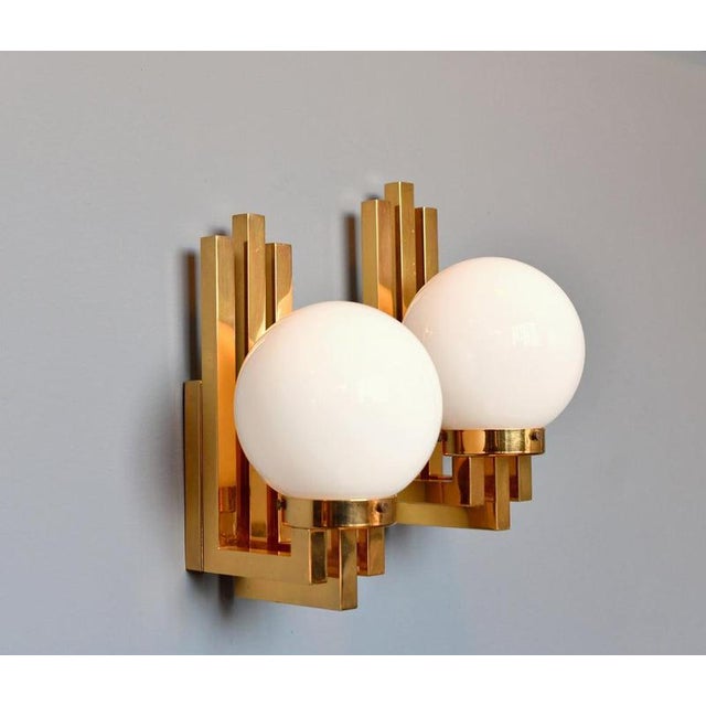 Hollywood Regency Wall Lights Circa 1970s Each light takes 1x E27 fitting bulbs Brass body with opaline glass globes Wires...