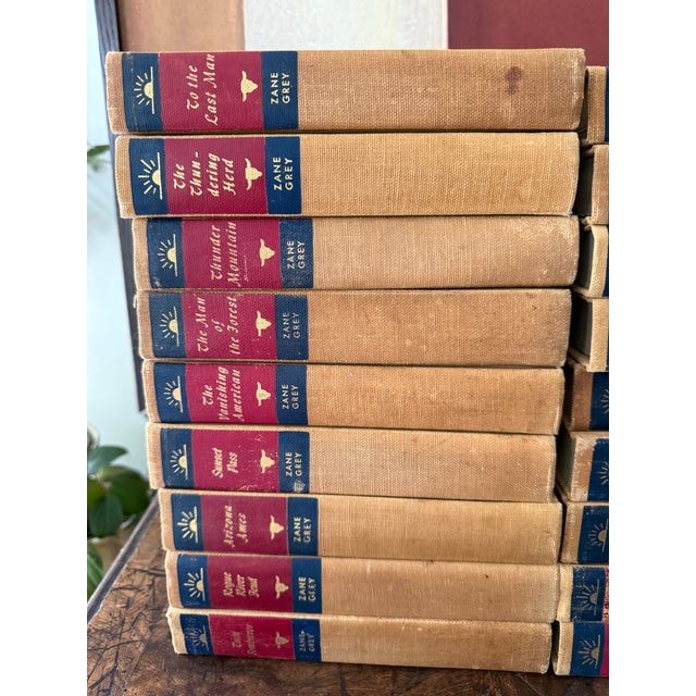 Mid-Century Set of 27 (Twenty Seven) Zane Grey Books Vintage Western Collection Tan Cloth Binding Red Blue Spine For Sale In Chicago - Image 6 of 12