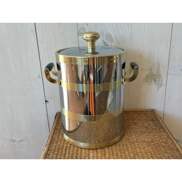 Large mid-century modern Kraftware NYC ice bucket! This tall and groovy silver- and gold-banded piece would really elevate...