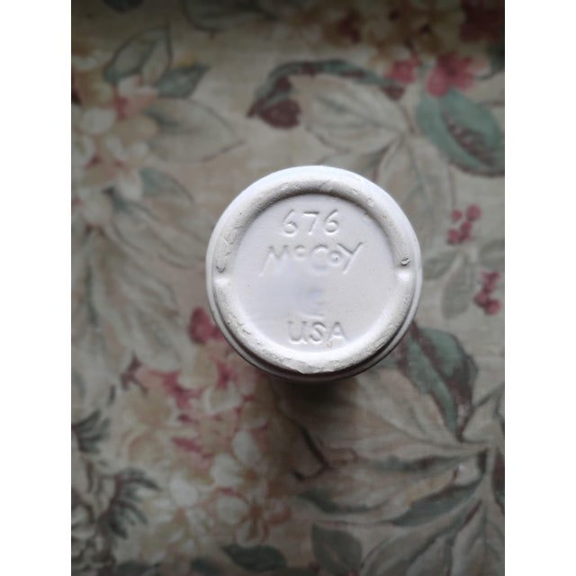 Mccoy bud vase featuring a transferware of purple with violets. Makers Mark on bottom with Mccoy 676 USA. Simple slim...