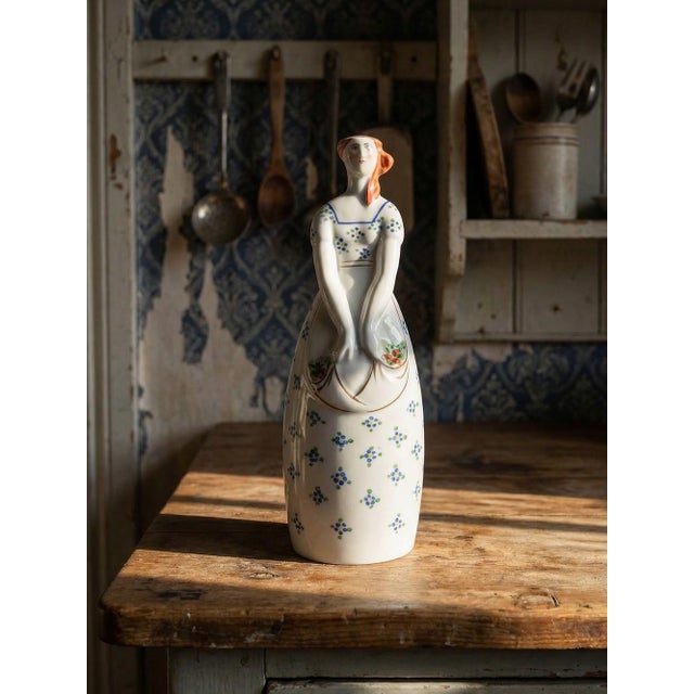 Very rare and charming, this decorative Limoges porcelain bottle, stamped ML, by Lucien Michelaud, features hand-painted...