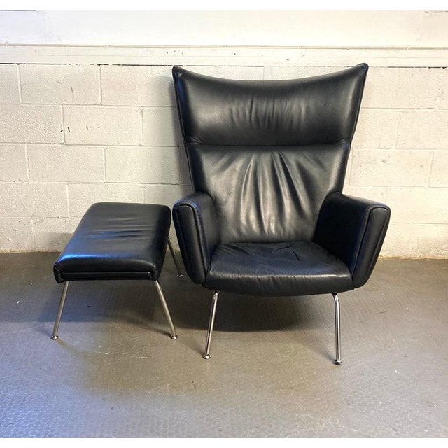 Vintage Modern Black Italian Leather Lounge Chair and Ottoman Fantastic mid-century modern black full-grain Italian...